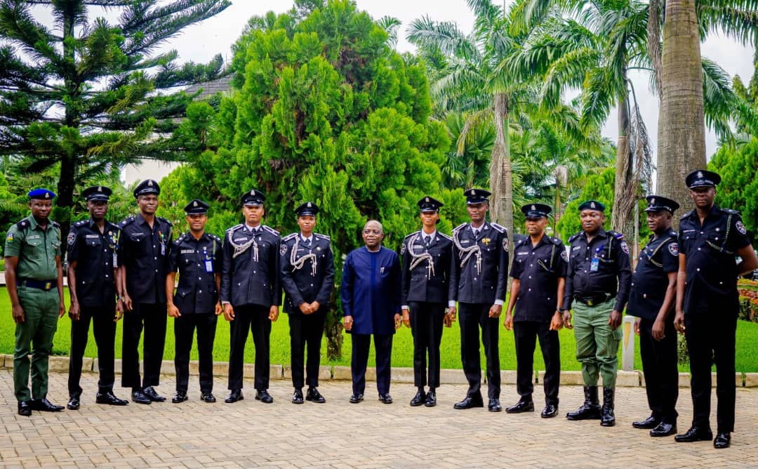 Gov Otti in a group photograph with the graduands and newly promoted Police Officers