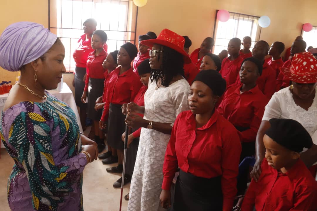 Mrs. Otti Marks Carol Of Nine Lessons with Students of School for the Blind, Reiterates Government Support