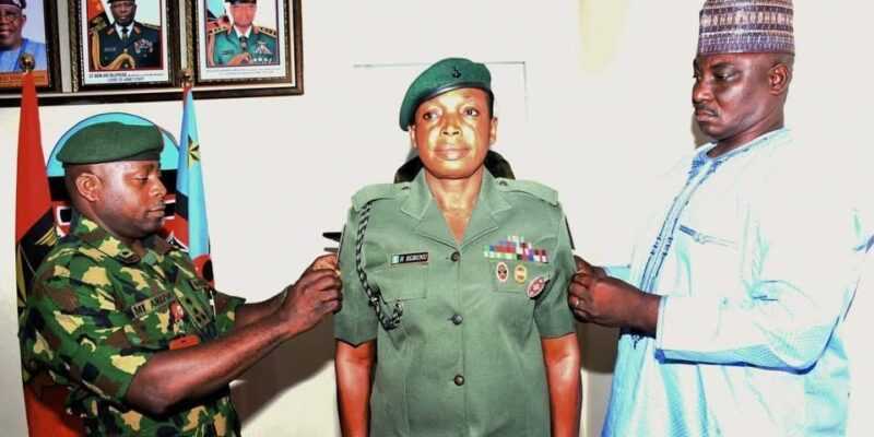 Hajara Egbunu (centre) becomes the first female soldier from the elite Infantry Corps and the NAWC to attain the prestigious rank of Army Warrant Officer